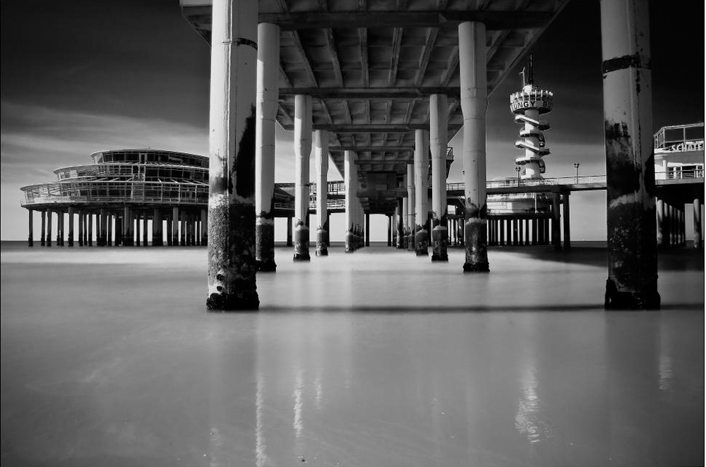 This is a long exposure shot during day light with an exposure of 30 seconds using an ND filter and taken under a famous pier in the Netherlands Black and White Photography